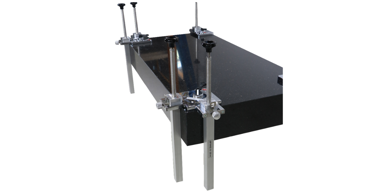 Black metal table miter clamps attached on a white background