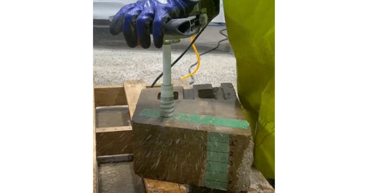 Alpha Vacuum-Brazed Core Bit in action cutting hole through thick material