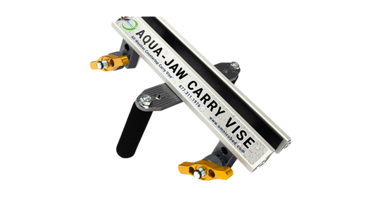 The Omni Cubed Aqua-Jaw Carry Vise, the highest capacity carry clamp available, is designed to securely hold wet stone without slipping, accommodating up to 800 pounds per pair.