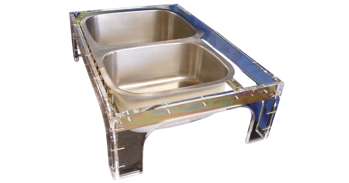 Full view of Sink Setter WP-114-P with sink in place and sitting in acrylic stand for visibility