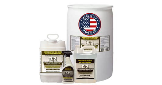 A white plastic D2 Biological Solutions drum and two smaller white plastic containers with black caps and labels, shown on a plain white background. The drum features a circular 'Made in USA' label with an American flag design.