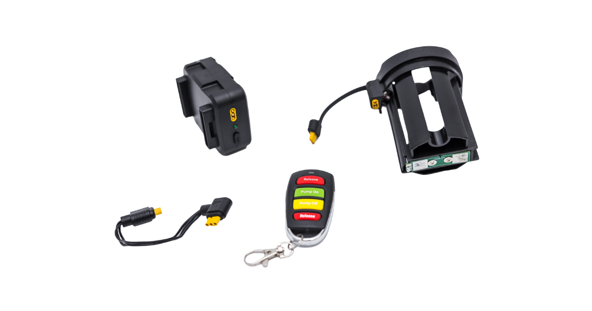 Set of electronic devices including a GRABO remote control and two receiveing pieces separated and a wire with a transparent background