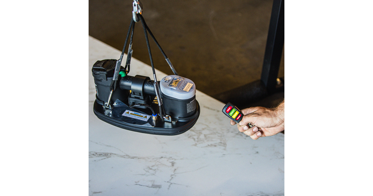 GRABO lifter with remote control lifting a natural stone slab