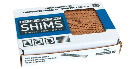 White Cardboard closed box with window showing composite shims inside box. Nelson Wood Shims blue, black and white writing on box