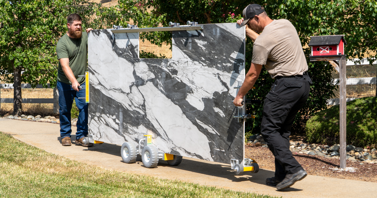 Omni Cubed Pro Dolly HD3 - 2 men moving large piece of Quartzite on dolly