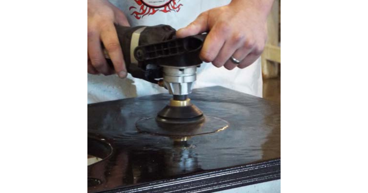 Person using Alpha VSP-320 Variable Speed Wet Polisher to remove scratches from countertop